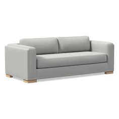 a gray couch with wooden legs on a white background