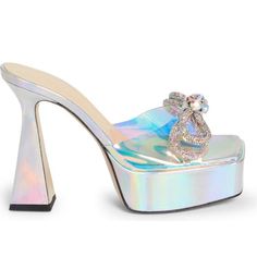 Glamorous Crystals Perfect The Double Bow Crowning This Iridescent Platform Sandal That's Set On A Fabulously Flared Heel. 5 1/2" Heel (140mm) Synthetic Upper/Leather Lining And Sole New/Unworn - Does Not Include Box/Dust Bag Welcome To The Official Luxury_snob Poshmark Closet. Luxury_snob Is A Luxury Brand Reselling Company Founded In Chicago Il In 2015. The Boutique Provides A Curated Collection Of New And Pre-Owned Pieces From The World’s Most Beloved Luxury Brands. We Guarantee All Our Items Glamorous Metallic Sandals For Wedding, Iridescent Sandals For Summer Parties, Iridescent Heels For Formal Summer Events, Glamorous Shiny Heels For Party, Glamorous Shiny Heels For Formal Occasions, Glamorous Shiny Party Heels, Summer Formal Iridescent Heels, Summer Party Iridescent Sandals, Luxury Glitter Sandals For Summer