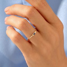 Elevate your style with our Basic Marquise Sapphire Ring, a minimalist and elegant piece designed for women who appreciate the timeless beauty of marquise-cut sapphires and the significance of a birthstone ring. Ring Details ❥  14k Solid Gold (also in 18K) ❥  Gold Colour Options: Yellow Gold, White Gold, Rose Gold ❥  Band Width: 0.85 mm ❥  Top Width: 2.05x5.20 mm ❥  Thickness: 0.80 mm ❥  Gemstone: AAA Grade White Cubic Zirconia ❥  Ready to Ship 4-7 Business Days MORE FROM US Statement Rings: https://etsy.me/3bb0QYW More about my shop: https://etsy.me/3mwMnsA ESSENTIAL INFORMATION 💎 BRENNMORE pieces are handcrafted by 15-30 years of experienced craftsmen and made to order. 🎁 All pieces come in a special turquoise gift box wrapped beautifully with a ribbon 🌎 All of our materials are ethic Sapphire Birthstone Ring, Marquise Sapphire, Blue Gemstone Ring, Dainty Rings, September Birthstone Rings, Blue Gemstone Rings, Cute Engagement Rings, Gold Color Ring, Ring Marquise