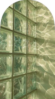 an image of a glass block wall that is reflecting the sun in it's reflection