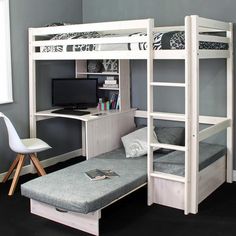 a bedroom with bunk beds, desk and chair in front of the bed has a blue snowboard leaning up against the wall