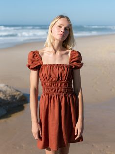 "CIELLE dress is just too cute. Your to-go dress. DETAILS - Short puff sleeve design - Square neckline - Shirred waist - Above the knee length - 100% lightweight European linen fabric - Cut and sewn to order just for you in our studio COLOR - Rust, you can also choose other colors above - Fabric samples are available here https://www.etsy.com/listing/586569696/linen-fabric-samples SIZING & FIT - True to size - Model is wearing a size XS - Model is 5'11″ / 180 cm tall CARE FOR LINEN - Machine wash up to 30ºC/86ºF gentle cycle - Lay flat to dry or tumble dry low - Warm iron if needed - Do not bleach SIZE GUIDE Size conversion guide Size XS (US 0-2, IT 36-38, UK 4-6, Japan 3-5, France 32-34) Size S (US 4-6, IT 40-42, UK 8-10, Japan 7-9, France 36-38) Size M (US 8-10, IT 44-46, UK 12-14, Japan Puff Sleeve Midi Dress With Smocked Bodice, Knee-length Mini Dress With Elastic Sleeves For Summer, Puff Sleeve Dress With Gathered Neckline And Fitted Bodice, Brunch Mini Dress With Elastic Short Sleeves, Casual Mini Dress With Puff Elastic Sleeves, Casual Beach Mini Dress With Gathered Sleeves, Fitted Mini Dress With Gathered Neckline And Puff Sleeves, Casual Mini Dress With Gathered Sleeves For Beach, Puff Sleeve Mini Dress With Smocked Bodice For Beach