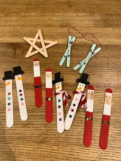 christmas decorations made from clothes pegs on a wooden table