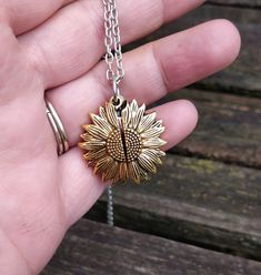 This cute sunflower necklace would make a great gift. It opens up and has a little red ladybug inside. The sunflower can be a gold or silver color and you may choose a gold necklace or silver necklace. The flower measures 1 inch and the necklace has an extender on it. This would make a great gift for a birthday, an anniversary, Christmas or any other occasion. All jewelry items come in a gift box. Memory Locket, Sunflower Necklace, Alex And Ani Charm Bracelet, Locket, Silver Color, Sunflower, Wedding Gifts, Silver Necklace, Gold Necklace