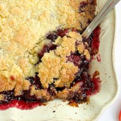 a close up of a pie on a plate with a fork and spoon in it