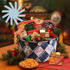 a basket filled with lots of food on top of a wooden table next to a snowflake