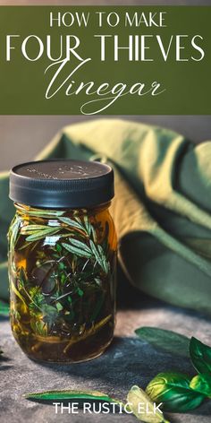 a mason jar filled with herbs and the words how to make four thives vinegar