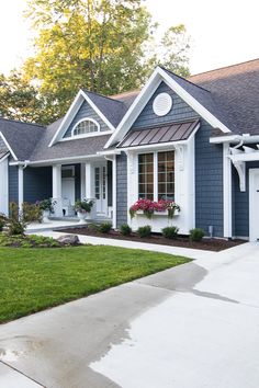 a blue house with white trim and windows