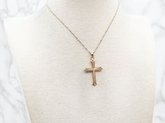 This exquisite yellow gold cross pendant is finely textured for a luxurious look. Crafted with intricate detail, it makes an elegant statement of your faith. Perfect for formal or casual wear.This pendant does not come with the chain shown. Please feel free to contact us, we will help you find the perfect chain for your style and budget!Metal: 14K Yellow GoldMeasurements: 23 x 40 mm, with bail Fine Jewelry Yellow Gold Cross Pendant Necklace, Fine Yellow Gold Cross Pendant Necklace, Yellow Gold Filigree Cross Pendant Necklace, Luxury Crucifix Cross Necklace For Formal Occasions, Gold Pendant Cross Necklace With Diamond Cut, Gold Cross Necklace With Figaro Chain, Gold Diamond Cut Cross Pendant Necklace, Fine Jewelry Diamond Cut Crucifix Cross Necklace, Diamond Cut Cross Pendant Necklace