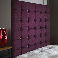 the headboard is made up to look like it has been made from purple fabric