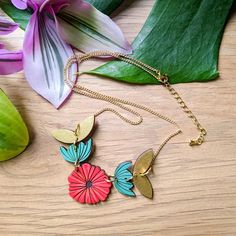 This abstract Scandinavian poppy necklace is a vibrant and modern piece that makes a perfect gift or art statement for yourself! This original necklace is hand painted on cherry wood in a palette of red, teal, and gold and features abstract flowers and leaves strung together for a fun and modern work of art. If you love scandi, mid-century modern, or abstract art, this necklace is for you! This necklace comes with a 17in 24k gold-plated brass dainty curb chain with a lobster clasp and gold-plate Handmade Red Artsy Necklace, Handmade Red Artsy Necklaces, Artsy Red Necklace For Gift, Poppy Necklace, Art Statement, Original Necklace, Statement Art, Kraft Gift Boxes, Art N Craft