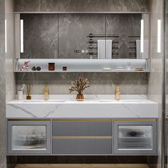 a bathroom with marble counter tops and gold accents