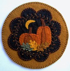 a close up of a patch with a pumpkin on it