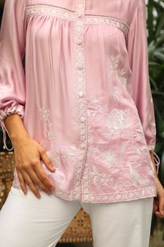 PRODUCT DETAIL: Introducing our "Pink Embroidered Top with White Linen Pants" - crafted from soft fabric and adorned with delicate lacework and embroidery, this cute top is perfect for the summer season. Pair it with denims or white pants for a stylish and effortless look. SPECIFICATIONS: Color Pink Fabric Modal Cotton Feminine Cotton Embroidered Top, Summer Embroidered Feminine Blouse, Summer Feminine Embroidered Blouse, Elegant Summer Top With Chikankari Embroidery, Feminine Embroidered Summer Blouse, Elegant Summer Chikankari Embroidered Top, Elegant Chikankari Embroidered Top For Summer, Elegant Embroidered Top With Resham For Spring, Pink Embroidered Feminine Blouse