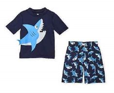 Koala Kids 2-Piece Swimsuit & Rash Guard Set Infant Boy Size 6 Months Fits 12-17 lbs., 24-27" height Navy blue swimsuit with a print of ocean sharks. The rash guard top is navy blue with a large shark printed on the front. It's little tail is sewn on the side. Excellent UPF 50 Sun Protection Brand New with Tags! I ship quickly, the same day or next day. My home is smoke free. Blue Swim Trunks For Ocean Activities, Blue Beachwear Swim Trunks For Ocean Activities, Blue Beachwear Swim Trunks For Beach Activities, Summer Swimming Sets With Short Sleeves, Short Sleeve Swimwear For Beach Play, Playful Swim Trunks For Ocean Activities, Blue Swim Trunks For Beach Playwear, Casual Swim Trunks For Ocean Activities In Summer, Playful Sets For Pool And Beach Season