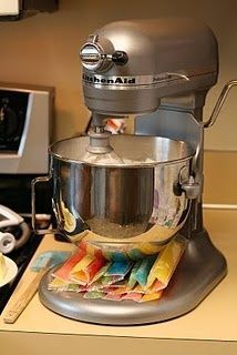 a silver mixer sitting on top of a counter