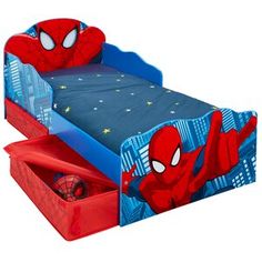 a child's bed with a spiderman theme on the side and two drawers