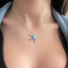 This unique blue flying swallow bird necklace would make a great statement. The blue swallow bird is handcrafted from titanium (the metal of Gods) 18 gauge sheet with a sterling silver chain.  The colors are being created by applying flame to the titanium. The results are always a surprise!  Perfect for layering with more necklaces. +Materials: Titanium + Sterling Silver 925' +Bird dimensions:  Length: 1" (25mm) Width: 0.78" (20mm)  +Comes on a Sterling Silver chain (925") +Chain Length: Choose Blue Bird Necklace, Peter Pan Necklace, Flying Swallow, Wanderlust Necklace, Blue Swallow, Wax Seal Jewelry, Spoon Necklace, Swallow Bird, Crescent Earrings