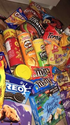 a pile of snacks sitting on top of a wooden floor