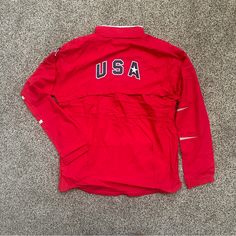 Olympic Nike Usa Track And Field Windbreaker In Red. In Perfect Condition, Never Worn. Ultra Light Weight Material, Perfect For Runners Or For Stylish Athleisure. Also A Great Way To Show Support During The Summer Olympics! Jacket Features American Flag, Team Usa Badge, And Nike Logo. Size: Xl Original Price: $200 Tags: Jacket, Coat, Red, Maroon, Sports, Athletics, Athleisure, Olympic Trials, Nike, Adidas, Performance, Warm Ups, Workout, Gym Wear, Utility, Olympics, Marathon, Runner, Running, Tr Nike Long Sleeve Outerwear For Sports Events, Red Sportswear For Sports Season, Red Sportswear Outerwear For Sports Season, Red Sportswear Outerwear For Sports Events, Sporty University Red Track Jacket, Red Track Jacket For Sports, Red Long-sleeved Track Jacket For Sports, Red Long Sleeve Track Jacket For Sports, University Red Long Sleeve Sports Outerwear