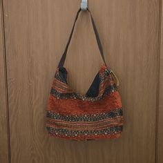 New Condition With Tag Attached. Casual Brown Fabric Shoulder Bag, Casual Brown Fabric Bag, Casual Orange Shoulder Bag For Daily Use, Casual Orange Hobo Shoulder Bag, Casual Orange Rectangular Hobo Bag, Casual Orange Hobo Bag For Daily Use, Orange Hobo Bag With Adjustable Strap For Daily Use, Orange Bag With Adjustable Strap For Fall, Orange Fall Bag With Adjustable Strap