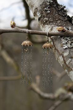 These raining umbrella earrings are so much fun! A super light weight and playful dangle earring to wear during those rainy days. I've hand crafted them in three varieties, please choose your preference from the drop down menu: 1-Patina added sterling silver chain rain with a raw brass umbrella and sterling hooks. 2-Patina added raw brass chain rain with a raw brass umbrella and sterling ear hooks. 3-Shiny sterling silver chain rain with a raw brass umbrella and sterling ear hooks Total length i Raining Umbrella, Umbrella Earrings, Physical Manifestation, Rain Jewelry, Rain Earrings, Fantasy Outfits, Bridesmaid Rings, Dangle Earrings Boho, Flower Band