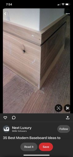 a wooden box sitting on top of a hard wood floor