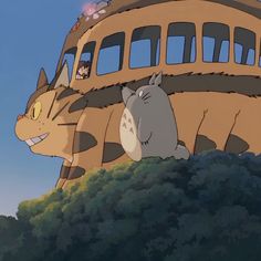 an animated image of two cats sitting on top of a building in the anime studio ghibli