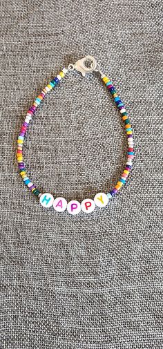 Rainbow beaded happy inspiration bracelet. 7.5 inches Trendy Bracelet Ideas, Cheerful Handmade Bracelet Jewelry, Handmade Cheerful Bracelet Jewelry, Cheerful Handmade Beaded Bracelets, Cheerful Handmade Adjustable Beaded Bracelets, Cheerful Handmade Bracelets As Gifts, Cheerful Handmade Bracelets As A Gift, Cheerful Colorful Beads Jewelry For Gifts, Cheerful Handmade Bracelet As A Gift