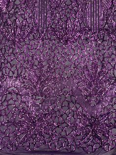 purple sequins on black fabric with silver stripes and circles in the center, as well as an intricate design