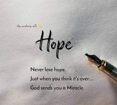 a pen sitting on top of a piece of paper with the words hope written in it