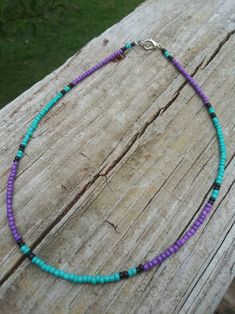 This choker features teal, black and purple seed beads. Purple Seed Bead Earrings, Black And Purple, Seed Bead Earrings, Beaded Necklaces, Beaded Choker, Bead Earrings, Jewelry Diy, Seed Bead, Chain Styles