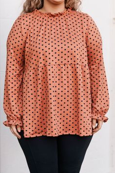 This top, crafted from a soft and stretchy fabric, features a high neckline with ruffle detailing and bubble sleeves for a on-trend look! The babydoll shape offers a flattering fit, perfect for day-to-night styling. Comfort and style? Yes, please! 95% Polyester, 5% Spandex Fall Tops With Ruffles And Balloon Sleeves, Fall Balloon Sleeve Tops With Ruffles, Casual Ruffled Balloon Sleeve Top, Casual Peplum Top With Ruffle Hem For Fall, Casual Fall Peplum Top With Ruffle Hem, Flowy Tops With Elastic Sleeves For Fall, Flowy Ruffled Tops With Balloon Sleeves, Flowy Balloon Sleeve Tops With Ruffles, Flowy Ruffle Balloon Sleeve Tops