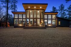 a modern house in the woods at night