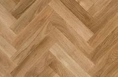 an image of wood flooring that looks like chevroned herringbones pattern