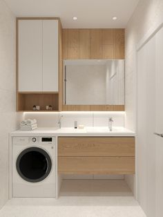 a washer and dryer in a bathroom with wood paneling on the walls