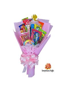 a pink bouquet filled with candy and candies