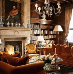 a living room filled with lots of furniture and a painting on the wall above it