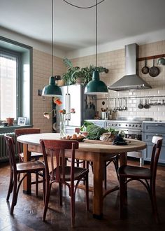 a kitchen with a table and chairs in it