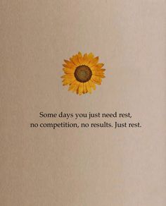 an open book with a yellow sunflower on the cover and some words written below it