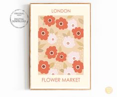 the london flower market poster is displayed on a white wall with a brown frame and red flowers