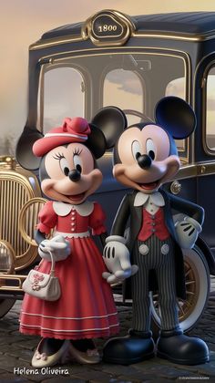 mickey and minnie mouse standing next to each other