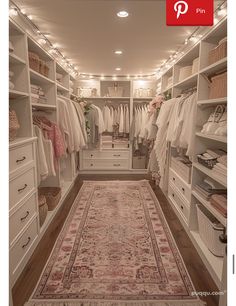 a walk in closet filled with lots of white furniture and drawers next to a rug