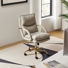 an office chair sitting on top of a white rug in front of a computer desk