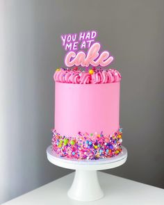 a pink birthday cake with sprinkles and the words you had me at cake