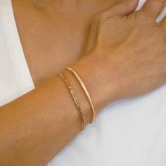 Inspired by all the working women who juggle many different jobs, the Contemporary Cuff Bracelet is the perfect blend of modern style and timeless elegance. Imagine a bracelet that complements every look, from casual daytime wear to elegant evening attire. A bracelet that offers the beauty of customization without compromising ease of wear. Our contemporary cuff bracelets are more than just accessories; they're a celebration of individuality and modern sophistication. Crafted with precision, the Elegant Adjustable Cuff Bracelet With Jubilee Design, Modern Gold Jubilee Bracelet For Everyday Luxury, Formal Cuff Bracelet With Single Cut Diamonds, Elegant Bangle Chain Bracelet, Elegant Jubilee Bracelet Cuff Jewelry, Minimalist Bracelet For Everyday Luxury, Minimalist Bracelets For Everyday Luxury, Elegant Double Band Adjustable Bracelets, Elegant Cuff Bracelet Jewelry