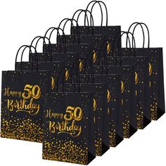 black and gold 50th birthday gift bags with golden confetti on the front, set of 10