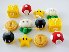 a collection of nintendo themed items on a white surface with question marks in the middle