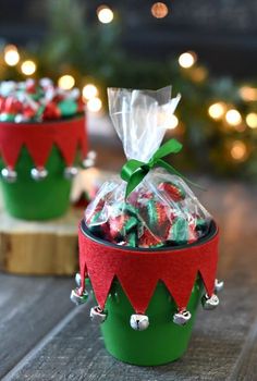 two small christmas baskets with candy in them