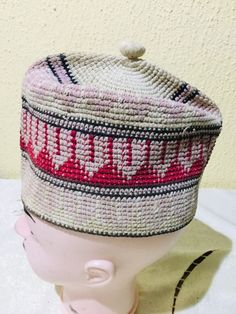 This is one of the best examples of this fabulous hat, so commonly worn throughout Muslim West Africa, that I have ever seen. In fact, typically, for a West African Muslim man he wears a fila as an important marker of his Muslim identity.  The embroidery may have been inspired, as is common for these caps, by Islamic architecture or script, whose significance is often very personal, unique to the individual for whom it was made. This hat has an interior circumference at the rim of (APPROX ~ 21.2 Pink Adjustable Flat Cap, Adjustable Pink Flat Cap, Adjustable Pink Bonnet Hat, Handmade Adjustable Pink Bonnet, Pink Adjustable Visor Hat, Adjustable Pink Bonnet, Beige Crochet Cap, Pink One Size Fits Most Flat Cap, Pink Adjustable Cap